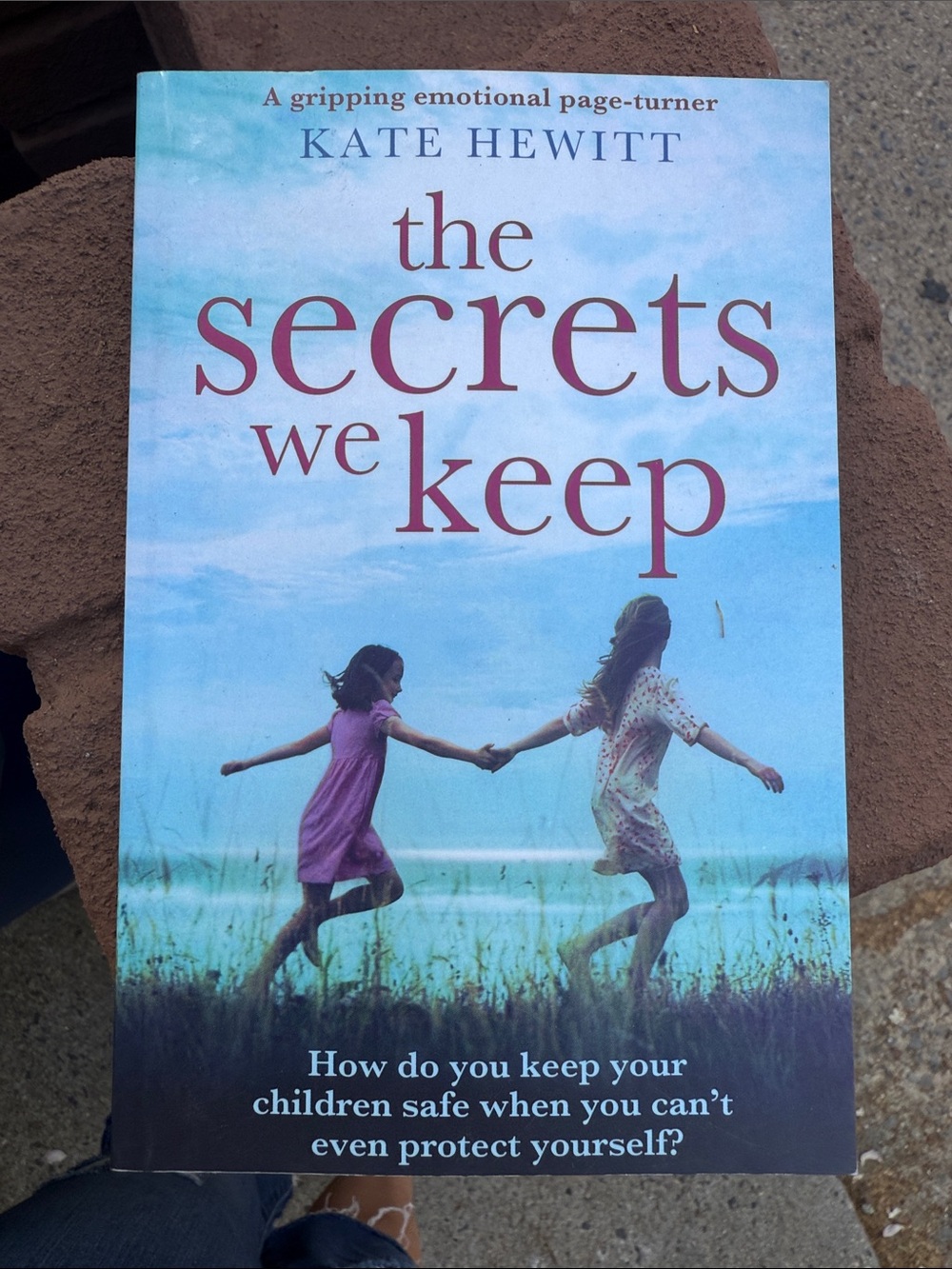 The Secrets We Keep by Kate Hewitt - Sky Blue & Pink Cover